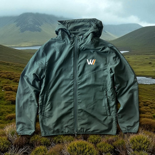 W/end Windbreaker Forest Green Jacket with a logo on a mountainous landscape